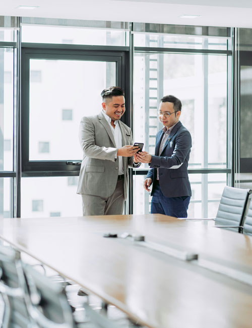 Business professionals discussing over phone
